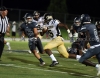 L.J. Currie runs through the defense.